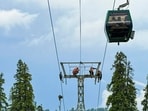 Visual of the rescue operation after around 300 tourists were stranded aboard the largest cable car as the system developed technical problems, at a Gulmarg resort in Jammu and Kashmir, Monday, May 25, 2026.