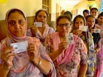 Voters queue up outside a polling booth in Jagraon on Tuesday. The elections recorded strong participation by women voters across several councils. (Gurpreet Singh/HT)