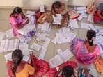 Electoral staff segregate forms of the special intensive revision (SIR) of electoral rolls, in Tirunelveli, Tamil Nadu, Thursday, Dec. 11, 2025. (PTI FILE PHOTO)