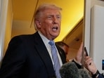 Donald Trump speaks to the press aboard Air Force One following his China visit.