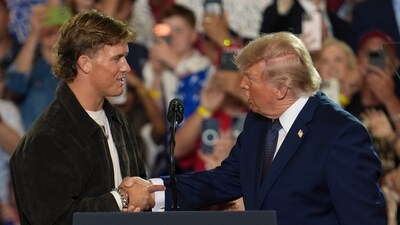 NFL quarterback Jaxson Dart, New York Giants QB, introduces Donald Trump during a Fighting For American Workers event, Friday, May 22. (AP Photo/Ryan Murphy) NFL quarterback Jaxson Dart, New York Giants QB, introduces Donald Trump during a Fighting For American Workers event, Friday, May 22. (AP Photo/Ryan Murphy)