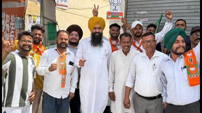 Onkar Singh (centre), a former officer on special duty (OSD) to chief minister Bhagwant Mann, posted campaigning photos on social media hours before Tuesday’s polling. Onkar Singh (centre), a former officer on special duty (OSD) to chief minister Bhagwant Mann, posted campaigning photos on social media hours before Tuesday’s polling.