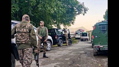 Security personnel stand guard during an anti-terror operation, in Rajouri district, Jammu and Kashmir, Tuesday. (PTI)