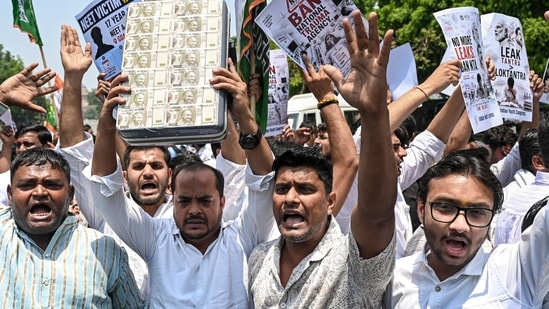 Indian Youth Congress (IYC) members stage a protest against the National Testing Agency (NTA) over the alleged paper leak concerns following the cancellation of the NEET-UG 2026 examination, in New Delhi, Saturday, May 16, 2026. (PTI)