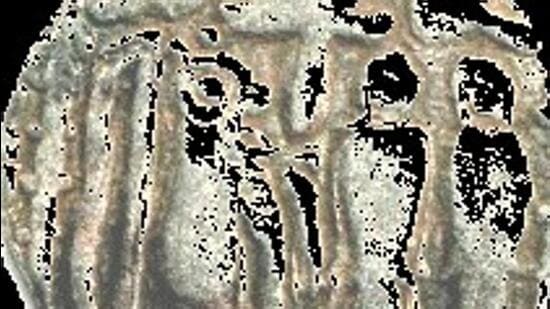 The Chola emblem—the tiger, along with two lamps and fish—forms are etched in the seal. (TamilNation.org website)