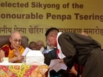 Tibetan spiritual leader the Dalai Lama (L) attends the oath taking ceremony of government's "sikyong" or leader Penpa Tsering (R), President of the Central Tibetan Administration at Namgyal Monastery in McLeod Ganj near Dharamsala. Tibetan spiritual leader the Dalai Lama (L) attends the oath taking ceremony of government's "sikyong" or leader Penpa Tsering (R), President of the Central Tibetan Administration at Namgyal Monastery in McLeod Ganj near Dharamsala.
