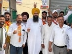 Onkar Singh (centre), a former officer on special duty (OSD) to chief minister Bhagwant Mann, posted campaigning photos on social media hours before Tuesday’s polling.