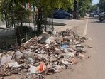Residents alleged illegal dumping, irregular garbage collection and dust accumulation continue across the locality. (Parveen Kumar/HT)
