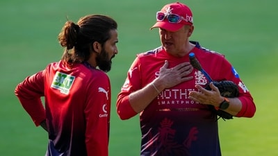 Royal Challengers Bengaluru's captain Rajat Patidar, left, and coach Andy Flower during a practice session (PTI)