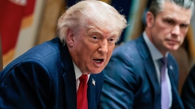US President Donald Trump speaks next to Defense Secretary Pete Hegseth during a cabinet meeting in the Cabinet Room at the White House, in Washington, DC (REUTERS)
