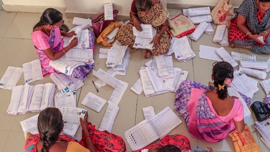 Electoral staff segregate forms of the special intensive revision (SIR) of electoral rolls, in Tirunelveli, Tamil Nadu. (PTI)