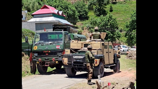 Security personnel stand guard during an ongoing anti-terror operation, in Rajouri district, Jammu and Kashmir, on Wednesday. (PTI)