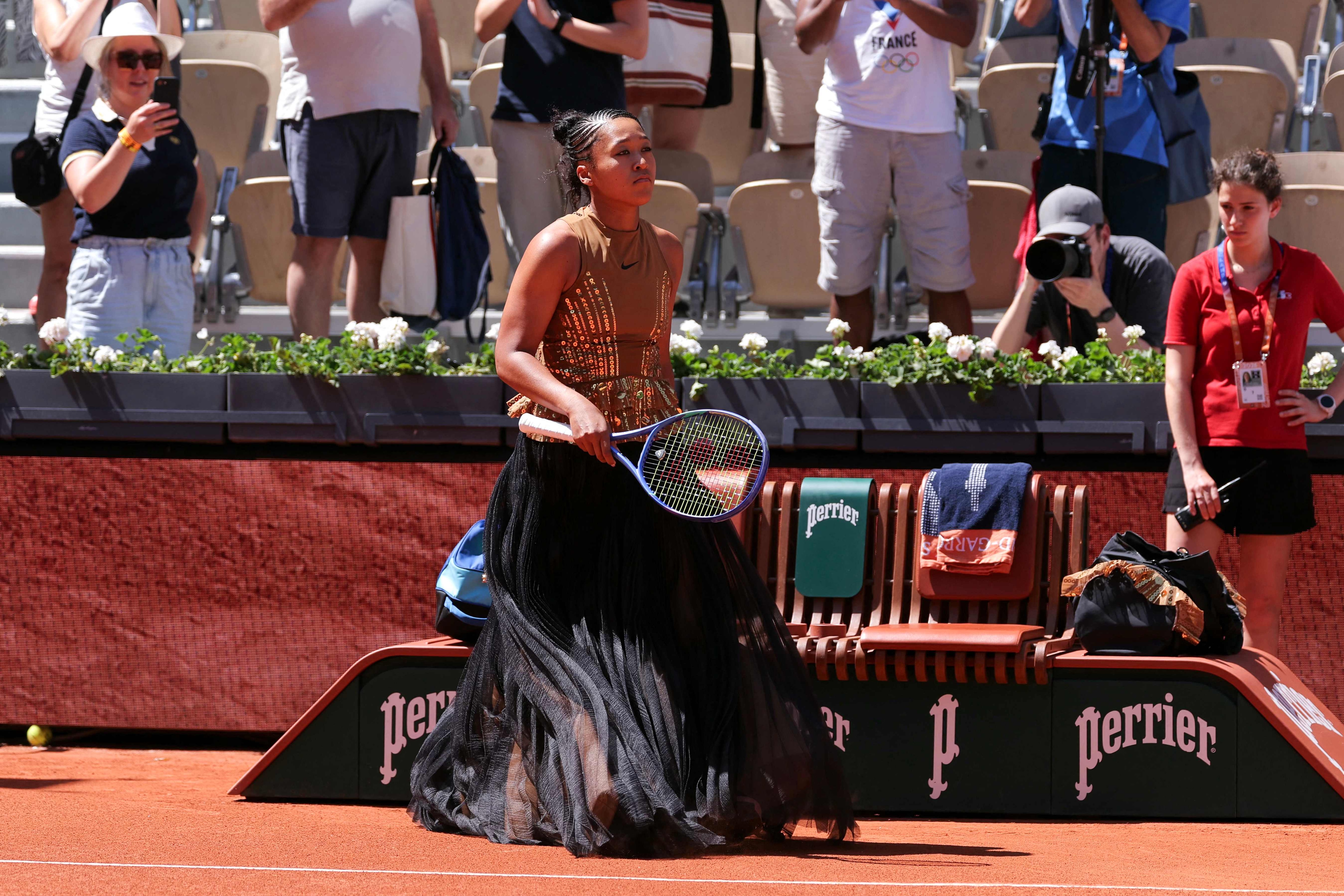Japan's Naomi Osaka arrives on Court Suzanne-Lenglen to play her women's singles match against Germany's Laura Siegemund on day 3 of the French Open tennis tournament at the Roland-Garros Complex in Paris on May 26, 2026. (Photo by Thomas SAMSON / AFP) (AFP)