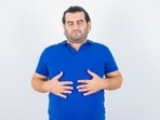 The 2-hour rule: a Mumbai doctor warns lying down post-meal could be ruining your gut. (Freepik)