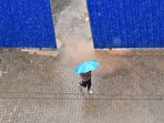 A man walks past a construction site holding an umbrella under heavy rain in Kochi, southern Kerala state, India, Wednesday, May 27, 2026. (AP Photo/ R S Iyer) A man walks past a construction site holding an umbrella under heavy rain in Kochi, southern Kerala state, India, Wednesday, May 27, 2026. (AP Photo/ R S Iyer)