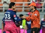 Rajasthan Royals' Indian cricket player Vaibhav Sooryavanshi (L) is congratulated by Sunrisers Hyderabad's Indian cricket player Abhishek Sharma