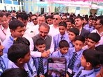 Chief minister Sukhvinder Singh Sukhu meets students during the visit to the newly upgraded CBSE Government Senior Secondary School, Nerwa, in Shimla district on Wednesday. (HT Photo)