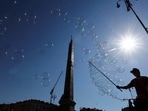 A person makes soap bubbles in Piazza del Popolo, in Rome, Italy, May 27, 2026,