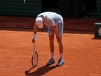 Jannik Sinner reacts as he feels unwell because of the heat during the second round match against Juan Manuel Cerundolo. (AP)