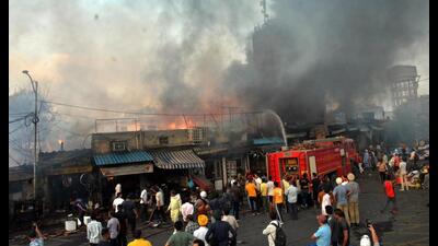 Fire brigade dousing flames at Rambagh market in Amritsar on Thursday. (Sameer Sehgal/HT) Fire brigade dousing flames at Rambagh market in Amritsar on Thursday. (Sameer Sehgal/HT)