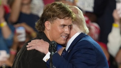 NFL quarterback Jaxson Dart, with the New York Giants, left, hugs President Donald Trump during a Fighting For American Workers event, Friday, May 22, 2026, in Suffern, N.Y. (AP Photo/Ryan Murphy) (AP Photo/Ryan Murphy)