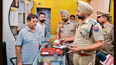 Police at the jewellery shop after the robbery in Jagraon on Thursday. (HT Photo) Police at the jewellery shop after the robbery in Jagraon on Thursday. (HT Photo)