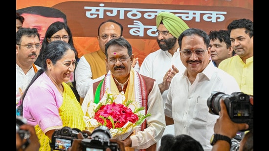 Delhi chief minister Rekha Gupta with newly appointed Delhi BJP president Harsh Malhotra during an event at the BJP party office, in New Delhi on May 28, 2026. (Hindustan Times)
