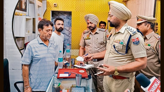 Police at the jewellery shop after the robbery in Jagraon on Thursday. (HT Photo)