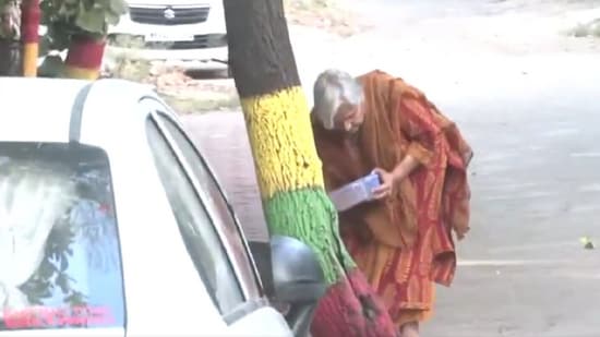 Twisha Sharma's mother-in-law Giribala Singh seen feeding stray dog the morning after the Jabalpur High Court squashed her anticipatory bail in death case (ANI)