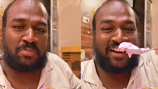 A man is seen happily enjoying a family pack of ice cream. (Instagram/@rakeshbucketlistjourney)