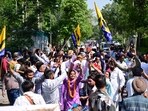 AAP supporters celebrate outside the Phase 7 counting centre on Friday. (Ravi Kumar/HT)