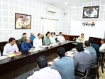 Uttarakhand Chief Minister Pushkar Singh Dhami chairs a meeting before unveiling the 'Solar Awareness Souvenir Booklet' prepared by the Council on Energy, Environment and Water (CEEW), at the Chief Minister's Camp Office, in Dehradun on Thursday.