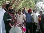 AAP supporters celebrate the party's lead in the Punjab Civic body polls in Amritsar.