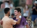 Novak Djokovic of Serbia, left, and Joao Fonseca of Brazil hug after their third round men's singles tennis match at the French Open tennis tournament in Paris.