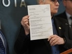 Hennepin County attorney Mary Moriarty holds up a document containing charges against ICE agent Christian Castro at the Hennepin County Government Center in Minneapolis, on Monday, May 18, 2026. (Renée Jones Schneider/Minnesota Star Tribune via AP) Hennepin County attorney Mary Moriarty holds up a document containing charges against ICE agent Christian Castro at the Hennepin County Government Center in Minneapolis, on Monday, May 18, 2026. (Renée Jones Schneider/Minnesota Star Tribune via AP)