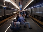 A fire in an Amtrak maintenance train near Penn Station injured five people and disrupted commuter services. 