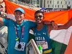Nitin Gupta (right) poses with his coach, Basant, after winning in Hong Kong on Friday. (SOURCED)