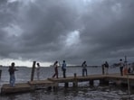 Visitors at the Marine Drive on a rainy afternoon, in Kochi. Visitors at the Marine Drive on a rainy afternoon, in Kochi.