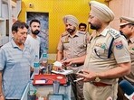 Police at the jewellery shop after the robbery in Jagraon on Thursday. (HT Photo) Police at the jewellery shop after the robbery in Jagraon on Thursday. (HT Photo)