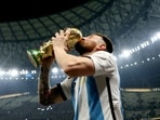 FILE PHOTO: Soccer Football - FIFA World Cup Qatar 2022 - Final - Argentina v France - Lusail Stadium, Lusail, Qatar - December 18, 2022   Argentina's Lionel Messi kisses the trophy as he celebrates winning the World Cup REUTERS/Hannah Mckay/File Photo
