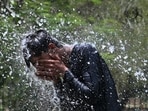 A man cools off on a hot summer day, at a park in Karachi on May 12, 2026.