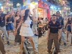 Indian tourists dance on railway track in Vietnam.