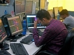 A share broker reacts as Sensex and Nifty prices plummet in Kolkata.