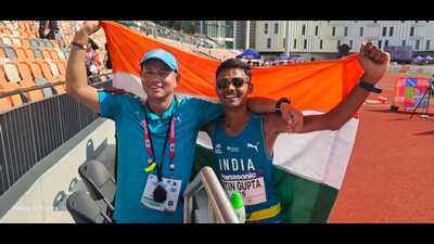 Nitin Gupta (right) poses with his coach, Basant, after winning in Hong Kong on Friday. (SOURCED) Nitin Gupta (right) poses with his coach, Basant, after winning in Hong Kong on Friday. (SOURCED)