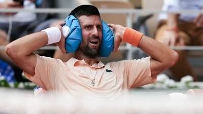 Serbia's Novak Djokovic reacts while sitting in between games as he plays against Brazil's Joao Fonseca (AFP)