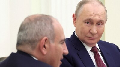 Russian President Vladimir Putin and Armenian PM Nikol Pashinyan attend a meeting at the Kremlin in Moscow in April 2026. (Photo via Reuters)