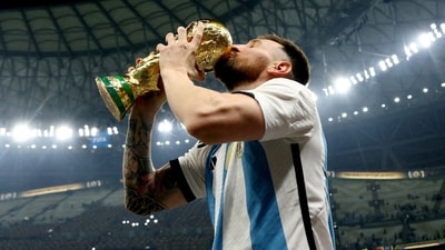 FILE PHOTO: Soccer Football - FIFA World Cup Qatar 2022 - Final - Argentina v France - Lusail Stadium, Lusail, Qatar - December 18, 2022   Argentina's Lionel Messi kisses the trophy as he celebrates winning the World Cup REUTERS/Hannah Mckay/File Photo (REUTERS)