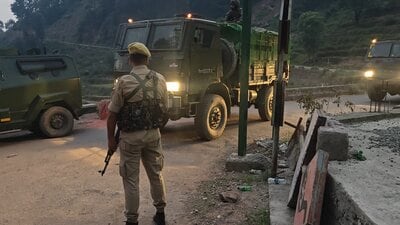 Security personnel maintain a tight vigil amid an ongoing encounter between security forces and terrorists following an anti-terror operation in the dense forest area of Dori Maal, in Rajouri district, on Friday. (PTI)