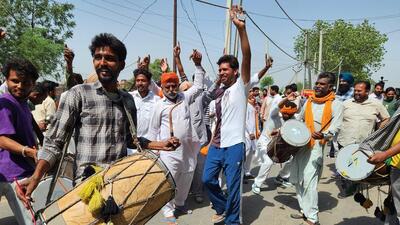 Supporters of AAP candidates celebrating outside a counting centre in Bathinda on Friday. (Sanjeev Kumar/HT) Supporters of AAP candidates celebrating outside a counting centre in Bathinda on Friday. (Sanjeev Kumar/HT)