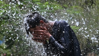 A man cools off on a hot summer day, at a park in Karachi on May 12, 2026. (AFP File) A man cools off on a hot summer day, at a park in Karachi on May 12, 2026. (AFP File)